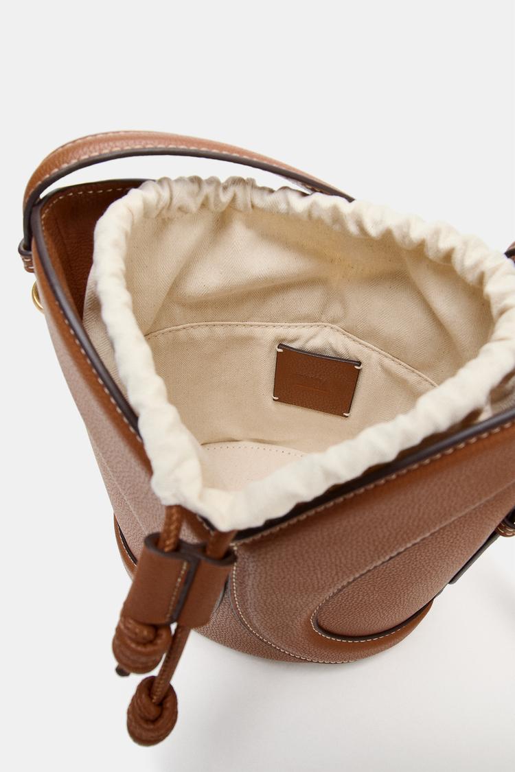 TOPSTITCHED BUCKET BAG